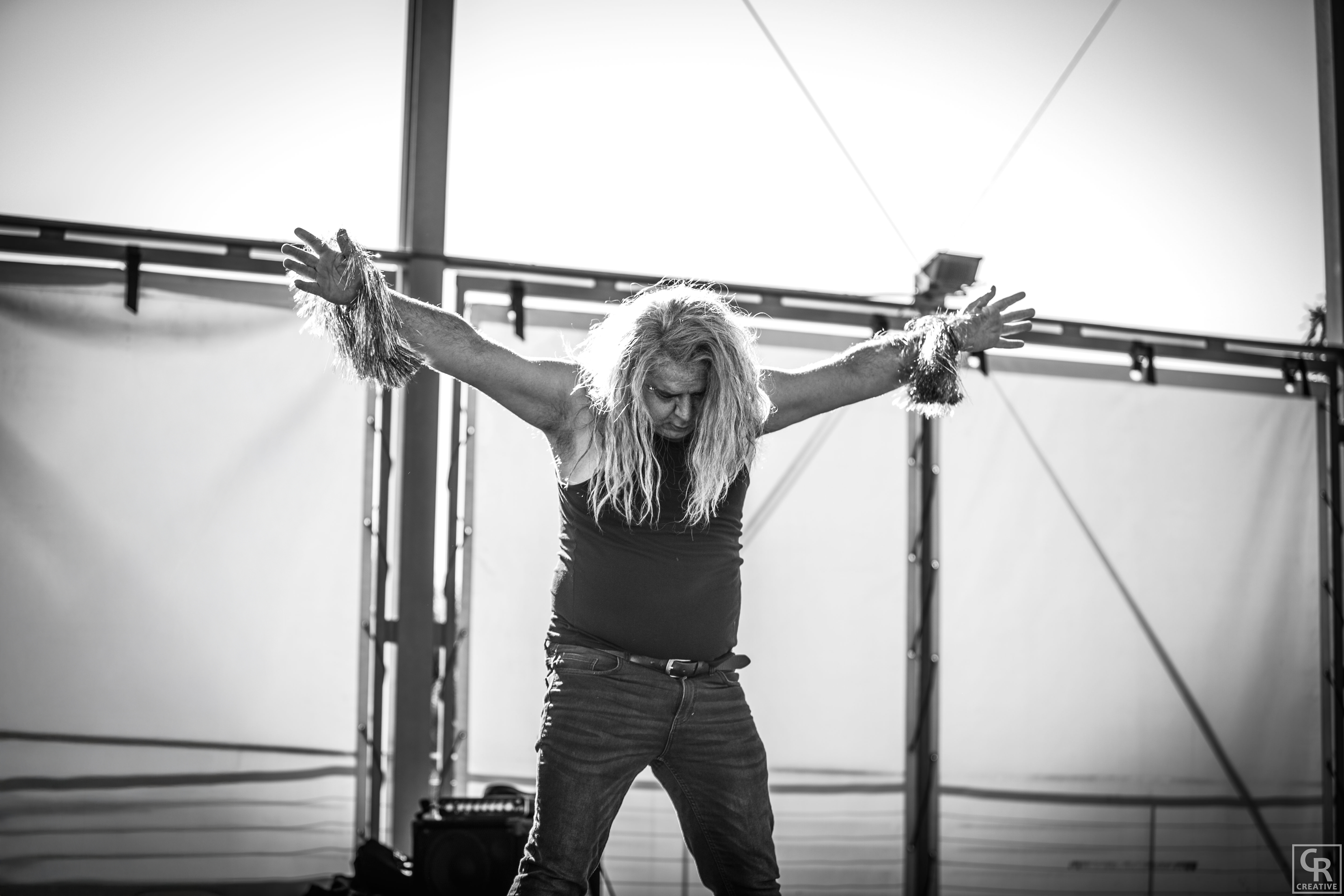 Van Ramsey performing live with arms outstretched
